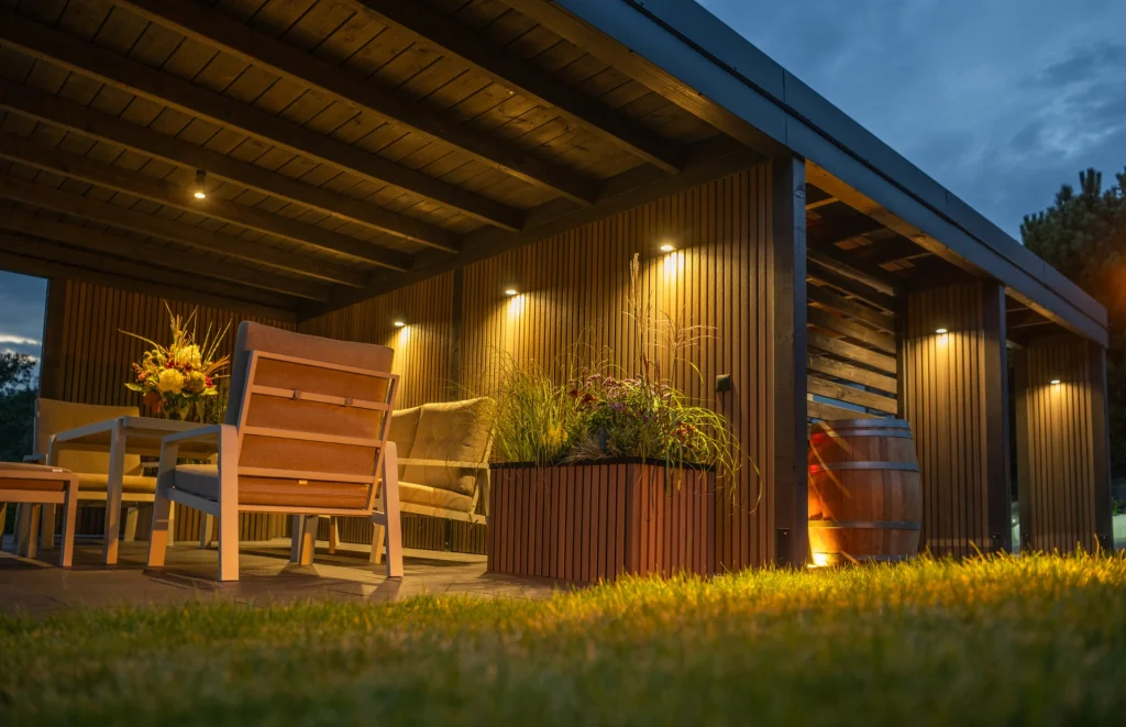 Cozy Outdoor Seating Area Featuring Wooden Furniture and Ambient Lighting