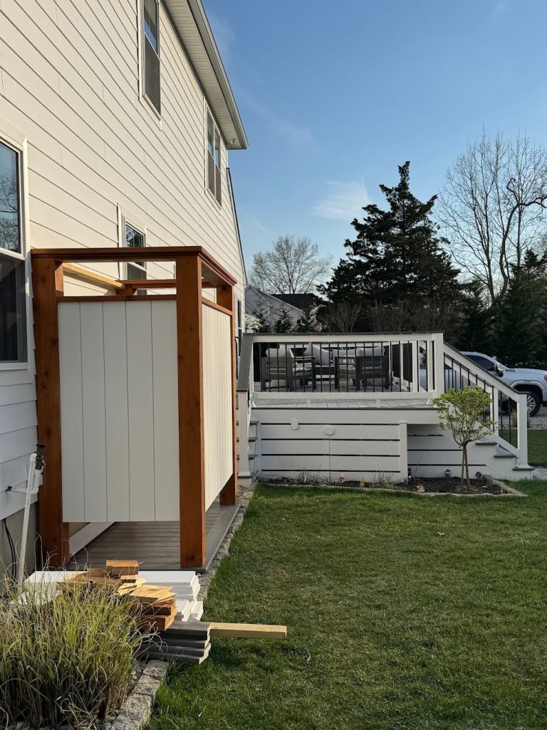 Wooden shed beside a outdoor deck